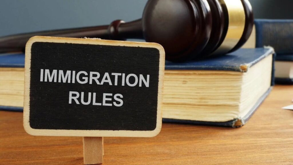 Immigration Rules blackboard with legal gavel and law books representing appendix v immigration rules 2025 technical analysis