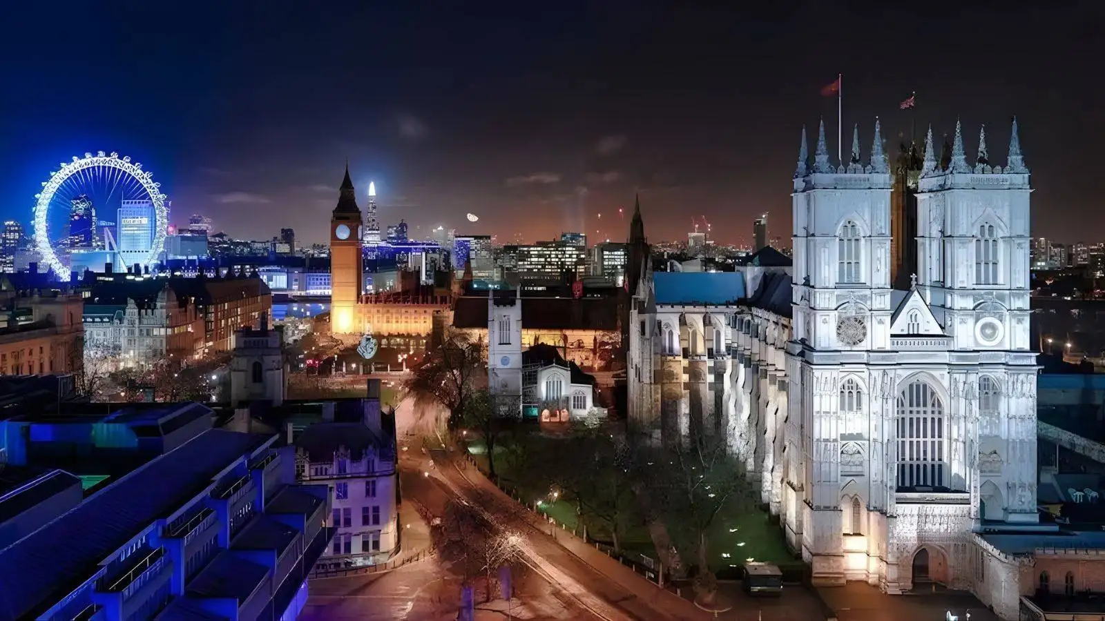 London landmarks including Westminster Abbey Big Ben and London Eye illuminated at night representing Life in the UK test 2025 British culture and heritage