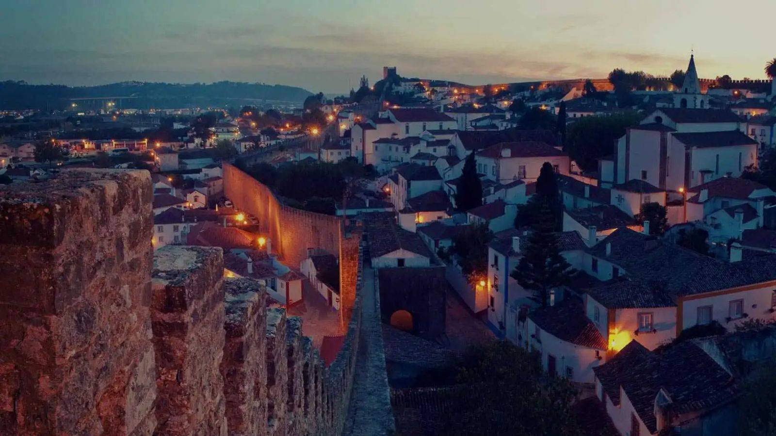 Portuguese interior town at sunset representing portugal golden visa program 2025 eligible investment regions