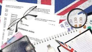 UK immigration documents including Home Office guidance forms residence permit and British currency representing staying in UK after divorce visa 2025 options including ILR parent route and domestic violence exception