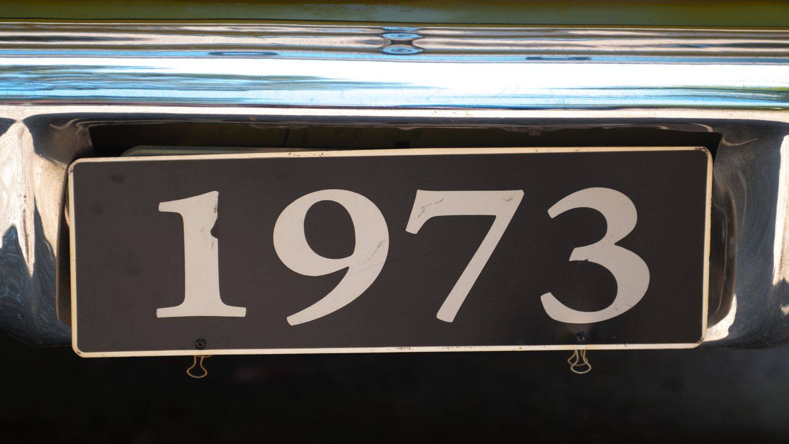 Vintage 1973 license plate representing EU rights UK immigration history timeline from EEC accession to 2025