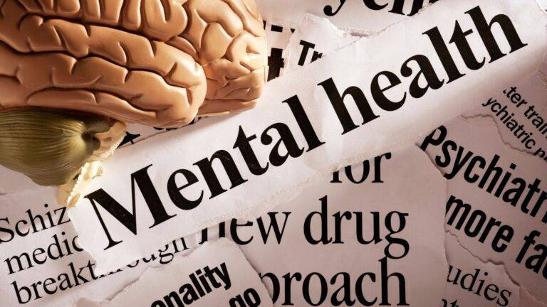 Medical brain model with mental health documentation representing ILR mental health evidence UK 2026 requirements for immigration applications