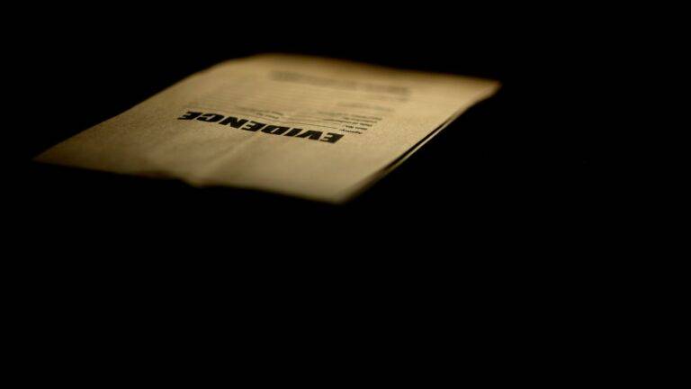 Evidence folder in dramatic lighting representing documentation requirements for evidential flexibility immigration rules 2026 PBS applications
