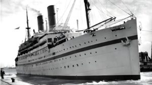 Historic Empire Windrush era passenger ship representing Caribbean immigrants arrival to UK and foundation for how to apply for windrush citizenship claims and compensation
