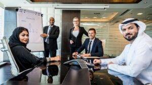 International business meeting with diverse senior professionals representing Senior or Specialist Worker visa 2025 cross-cultural collaboration and expertise transfer