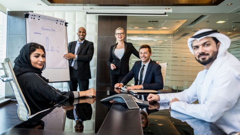 International business meeting with diverse senior professionals representing Senior or Specialist Worker visa 2025 cross-cultural collaboration and expertise transfer
