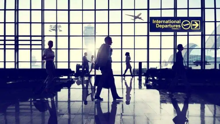 Airport International Departures Terminal With Travelers Representing Uk Citizenship Absence Rules 2026 Including 90-Day Final Year Limits And 450-Day Qualifying Period Requirements For Naturalization Applications
