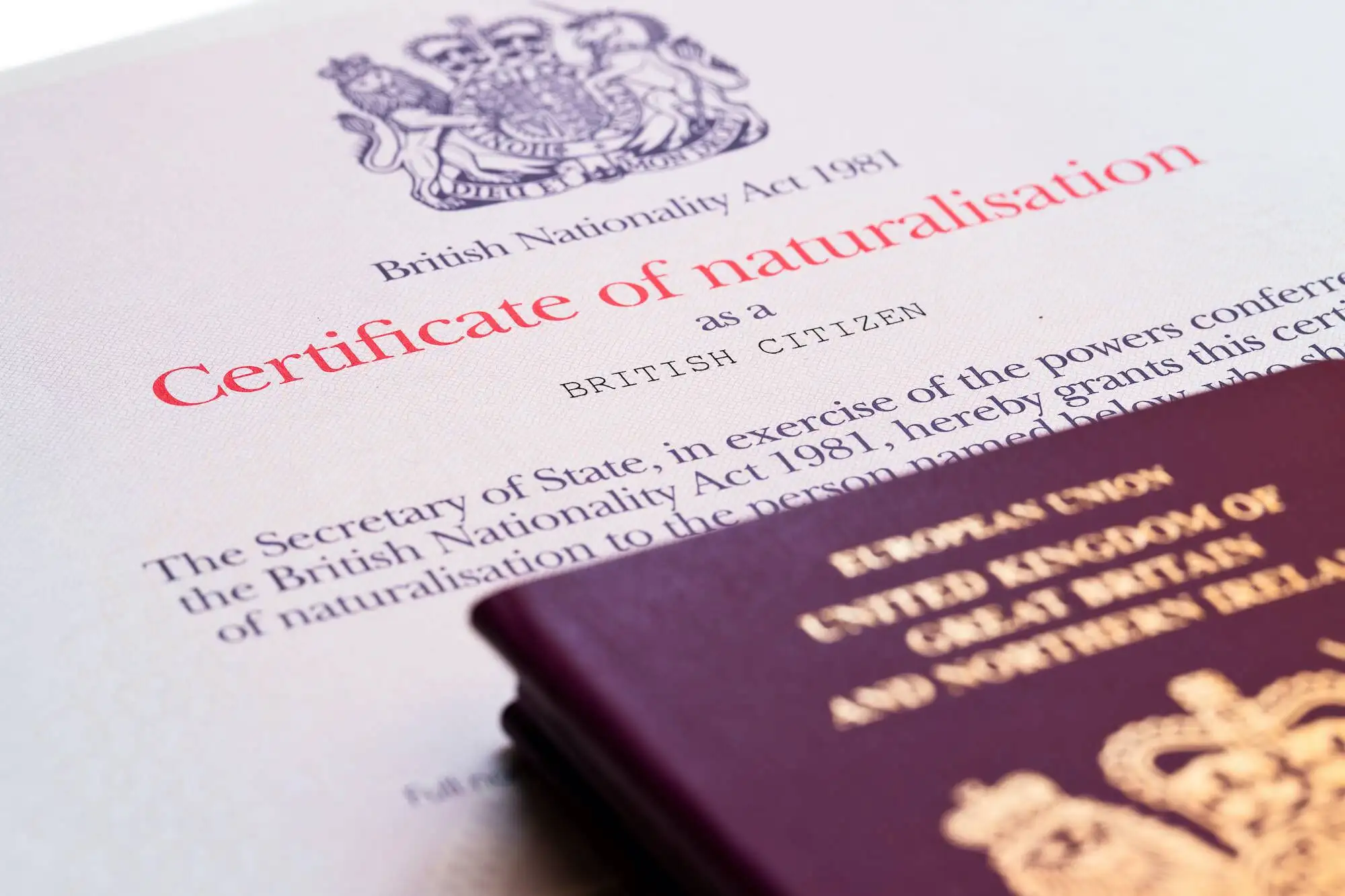 Certificate of naturalisation under British Nationality Act 1981 with UK passport representing Section 50(9A) paternity presumptions and citizenship rights for children born to unmarried parents