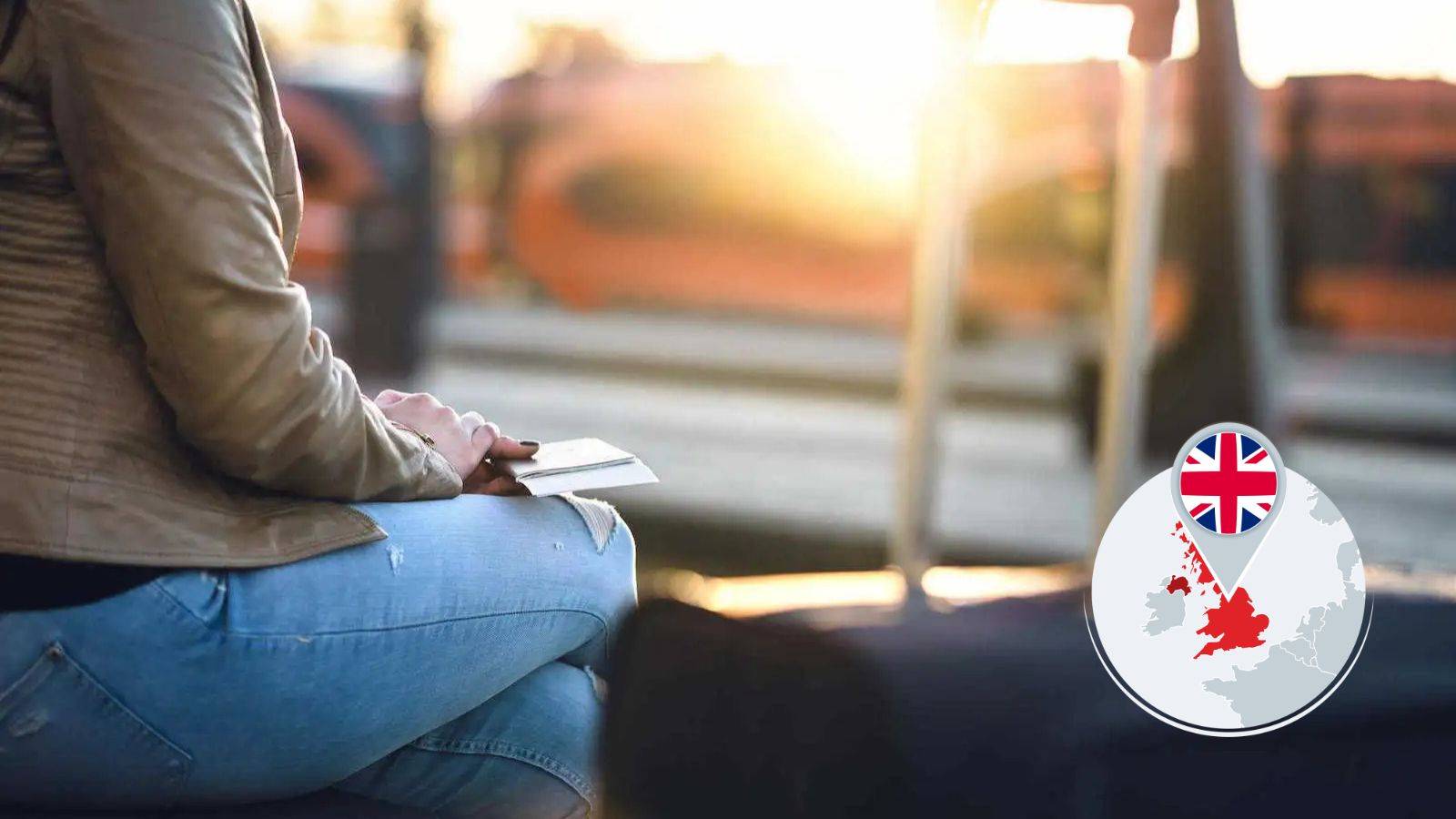 Person holding passport with luggage awaiting decision representing discretionary leave to remain UK 2025 application process