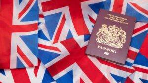 British passport on Union Jack flags representing is your child a british citizen documentation and citizenship status determination