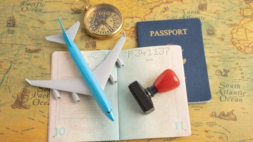 Passport with compass and map showing UK visa for non-EU family members 2025 immigration journey planning