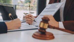 Immigration Lawyer Reviewing Section 94 Certification Documents With Client, Showing Legal Consultation For Clearly Unfounded Asylum Claims Uk 2025