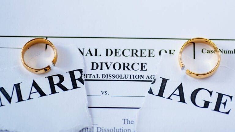 Grounds of divorce on 5 years separation 2026 – torn marriage certificate with separated wedding rings on legal decree