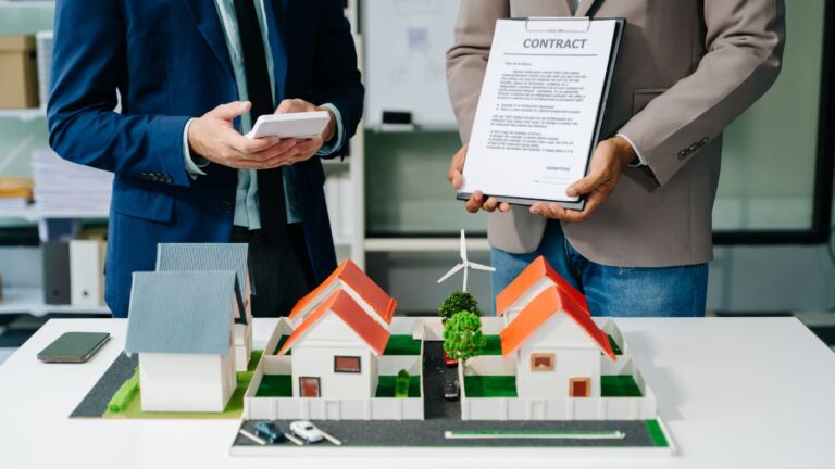 Professional property consultation with contract document representing statutory lease extension UK 2025 legal advisory process