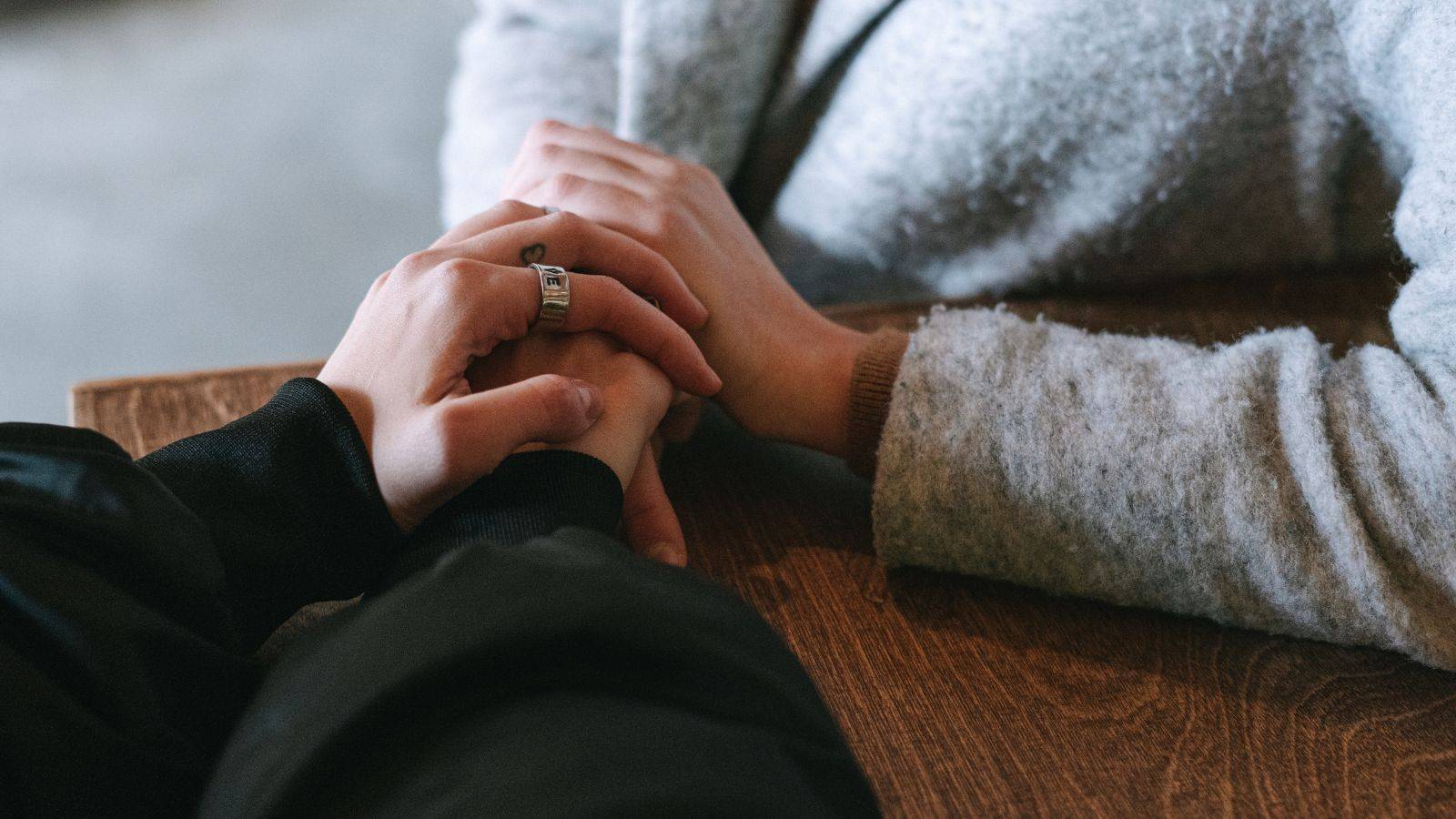 Supportive hands offering comfort representing bereaved partner ILR UK 2025 compassionate legal guidance