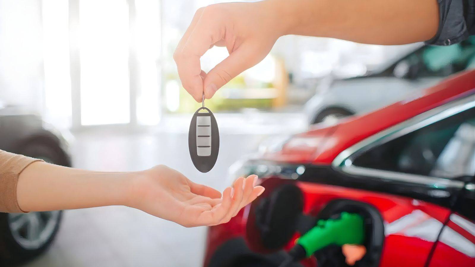 Car keys being handed over at dealership representing hire purchase agreements UK 2025 vehicle finance transaction and consumer rights under Consumer Credit Act