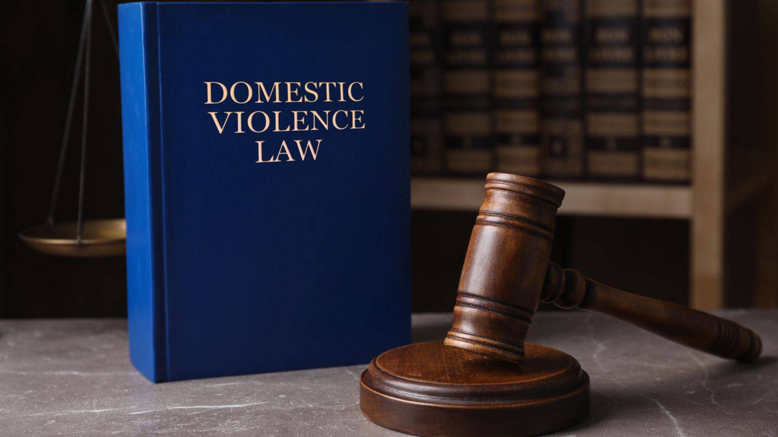 Domestic violence law book with gavel in legal library representing UK domestic violence immigration rights 2025 legal protections