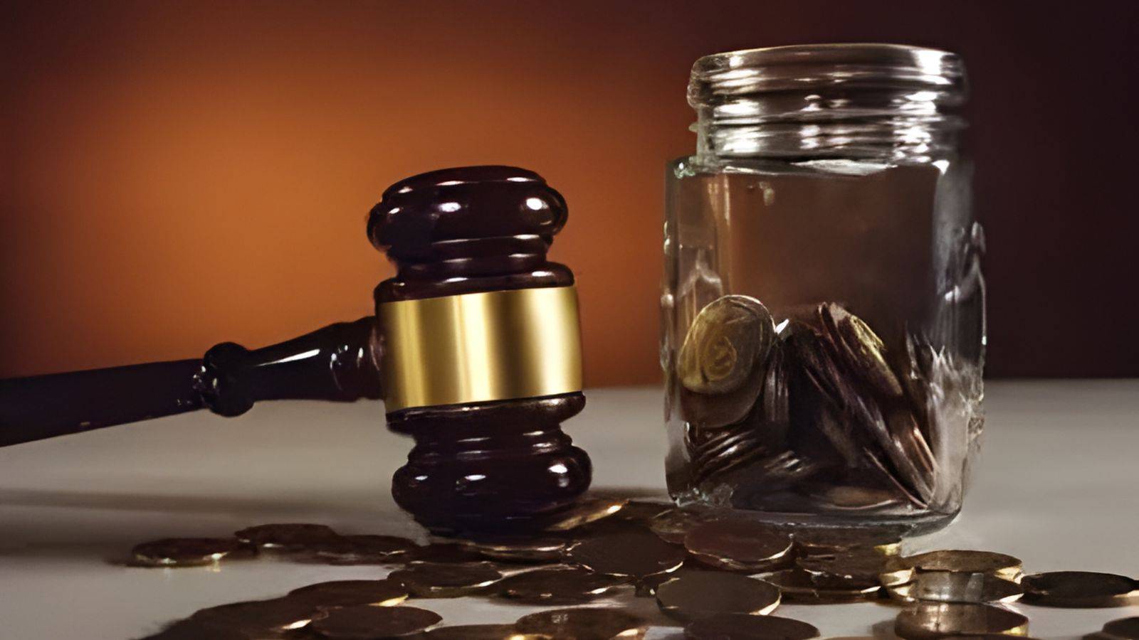 Judge gavel with broken jar and scattered coins representing divorce financial obligations UK 2025 and clean break orders ending spousal maintenance and ongoing claims
