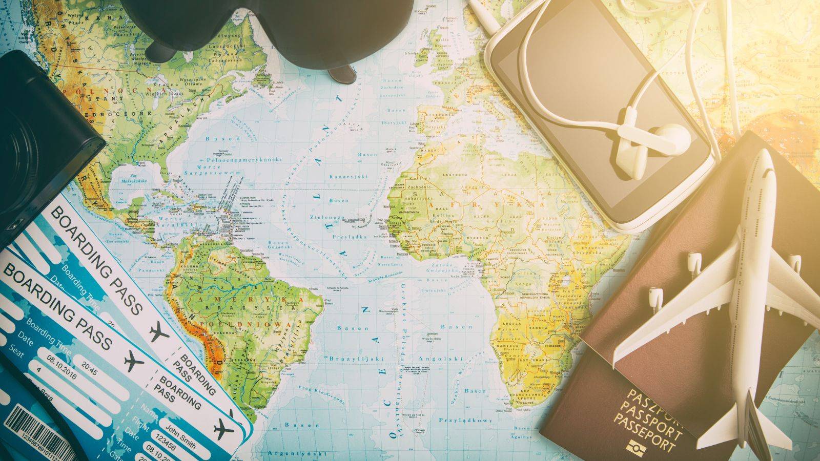 International child arrangements after divorce represented by world map with boarding passes airplane passport showing global travel consent permanent relocation Hague Convention procedures