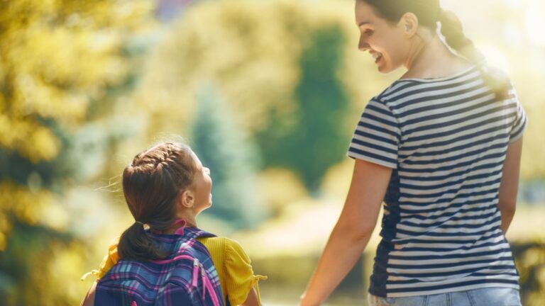Parent with child carrying school backpack representing parent child student visa UK 2025 requirements