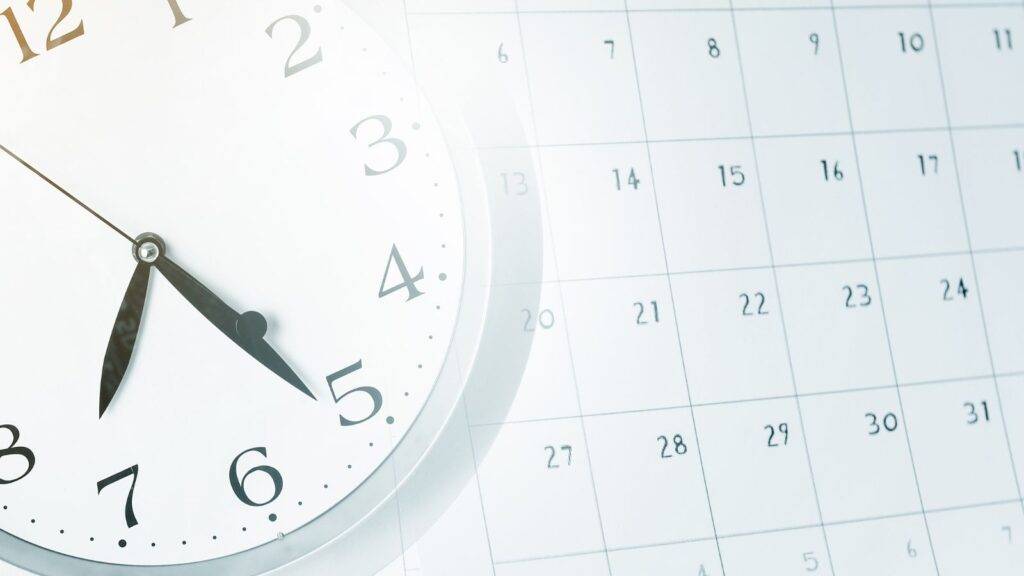 Clock overlaying calendar representing waiting periods and timelines when spouse does not respond to divorce papers UK 2025 deemed service procedures