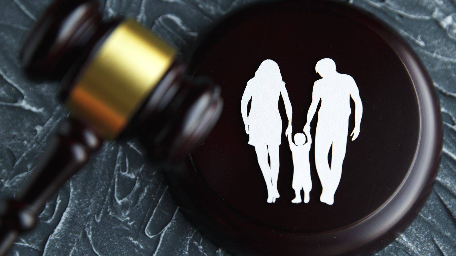 Family court gavel with symbolic family silhouettes representing substance abuse child custody cases UK 2025 legal proceedings and child welfare decisions