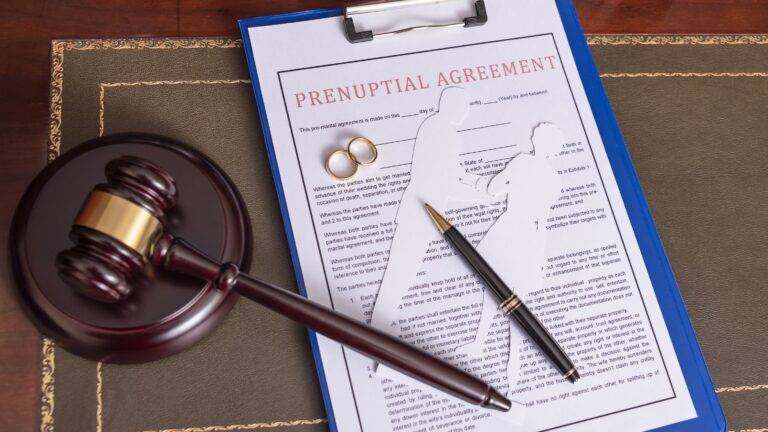 Prenuptial agreement document with judicial gavel and wedding rings representing prenuptial agreements UK 2025 legal framework and enforceability