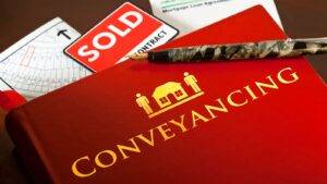 Conveyancing Legal Documents With Sold Sign And New Build Blueprints Representing New Build Conveyancing 2025 Services