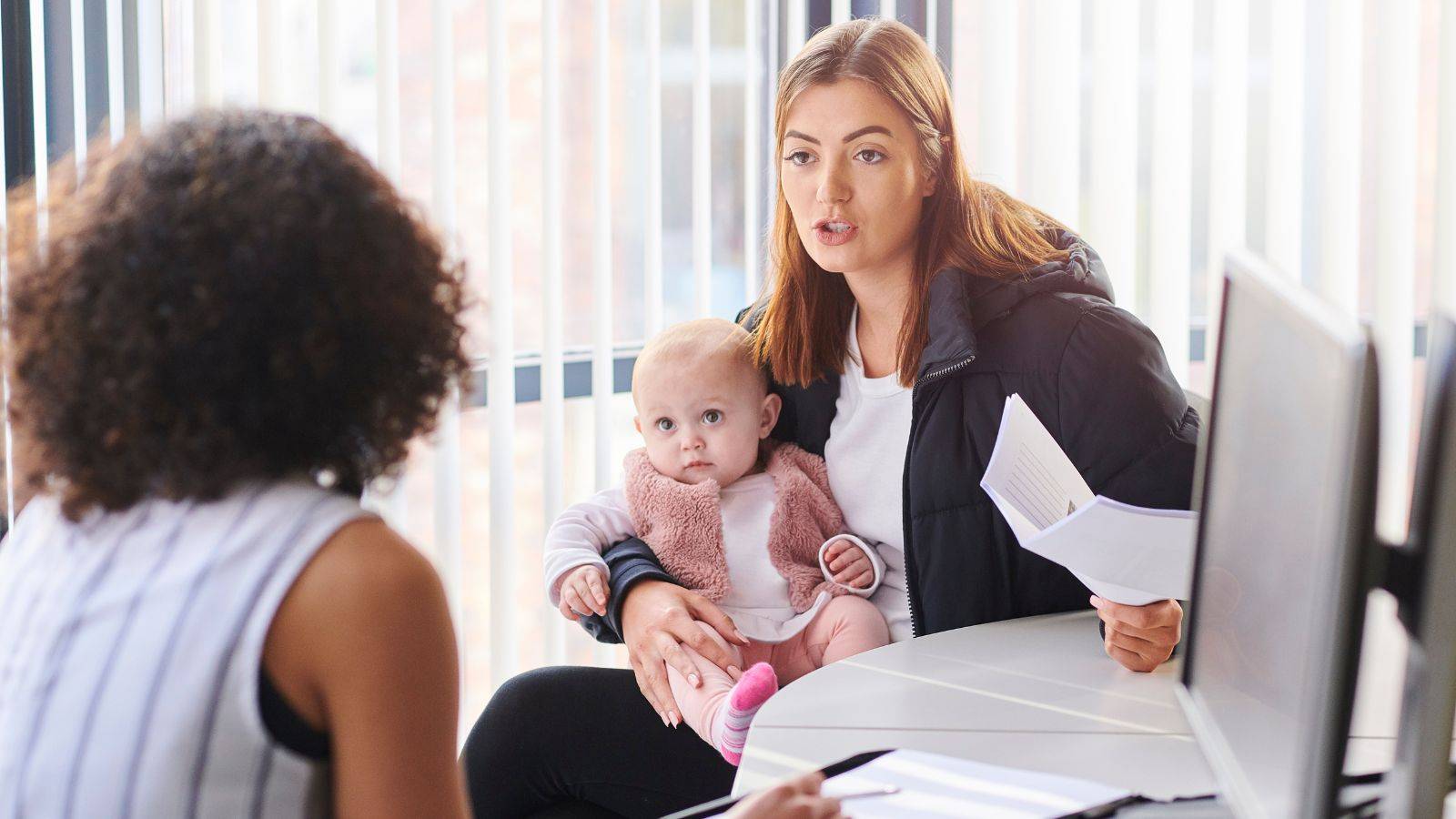Local authority involvement children represented by mother holding baby consulting with social services professional showing Section 17 Section 47 procedures care orders assessment meetings