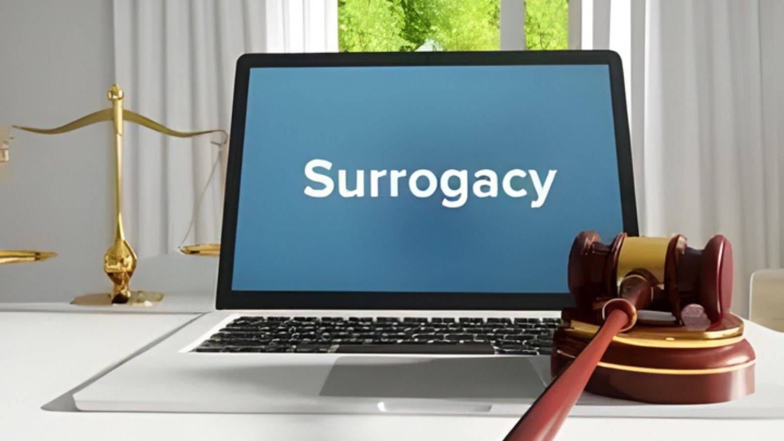 Laptop displaying surrogacy text with judicial gavel and scales representing UK surrogacy law 2025 reform updates and legal requirements