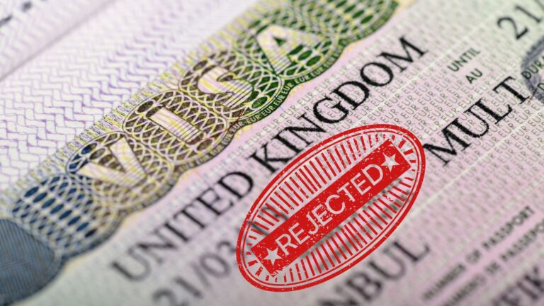 UK visa document with red rejected stamp illustrating UK visit visa refusal reasons 2025 including genuine visitor test failures and common rejection causes