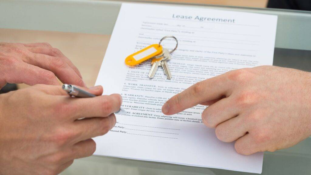 Professional reviewing lease agreement documents with property keys for voluntary lease extension UK 2025 consultation