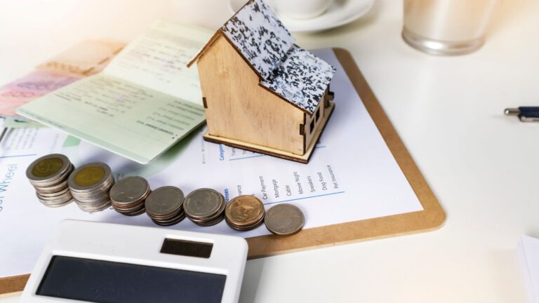 Property rental planning scene with documents calculator coins and house model representing essential tenant tips UK 2025 for competitive market success