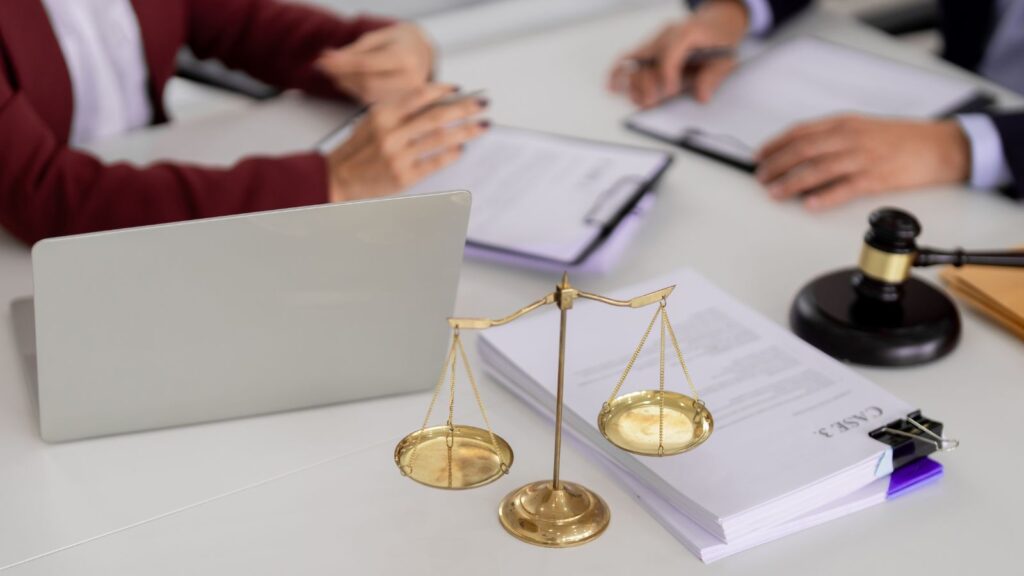 Golden scales of justice with legal documents and laptop representing administrative review UK visa 2025 challenge procedures