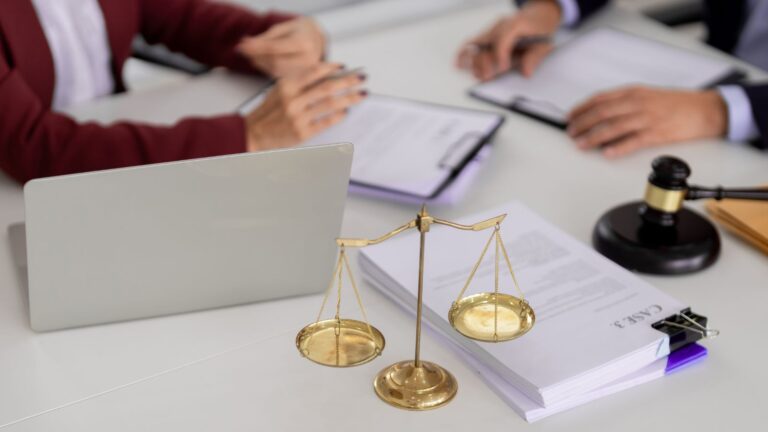 Golden scales of justice with legal documents and laptop representing administrative review UK visa 2025 challenge procedures