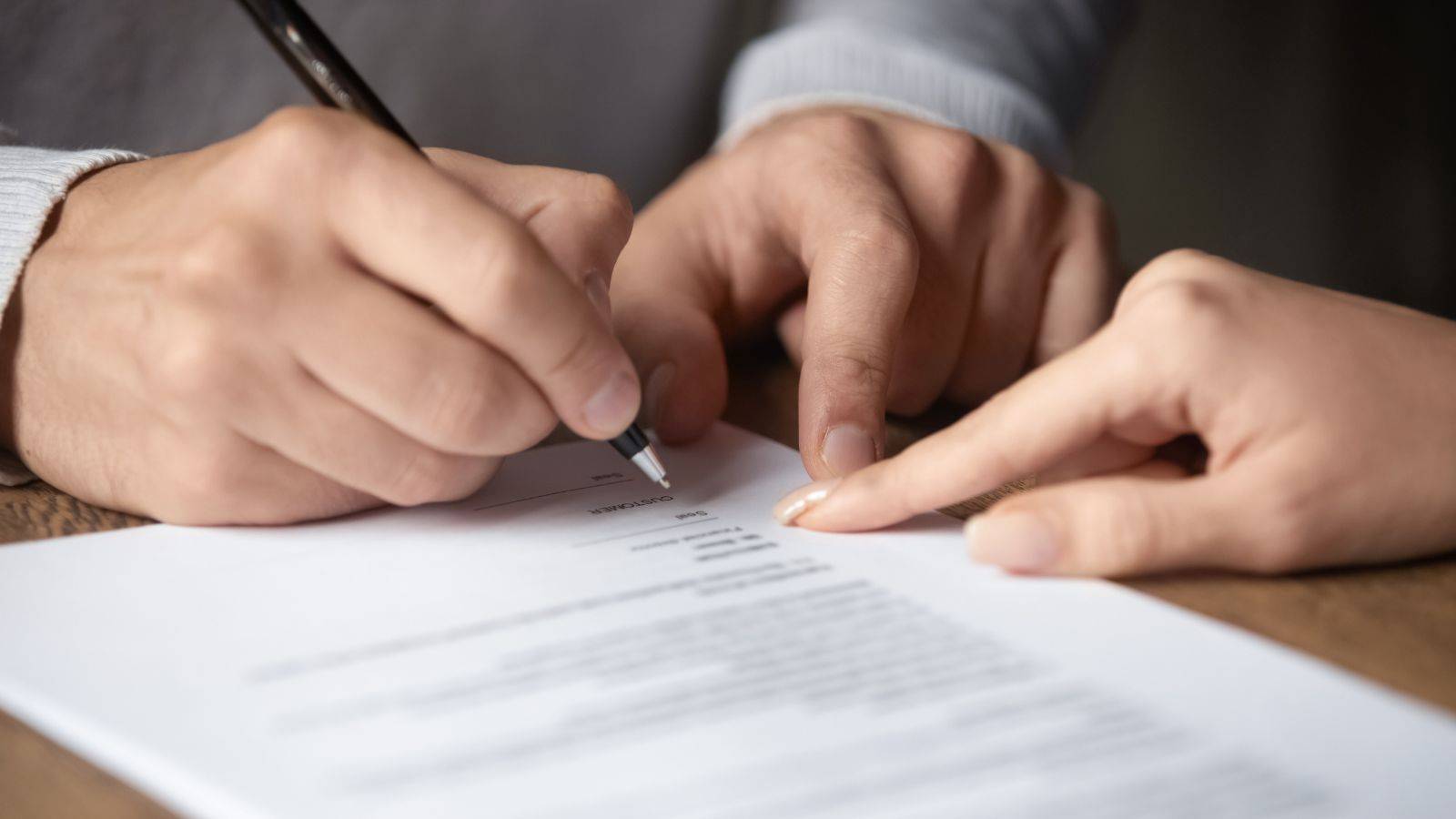 Client Signing Legal Document With Solicitor'S Guidance