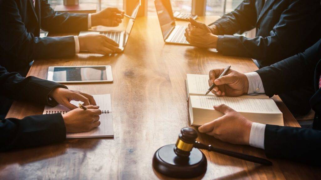 Professional consultation meeting with legal gavel representing interest only mortgages legal considerations UK guidance and advisory services