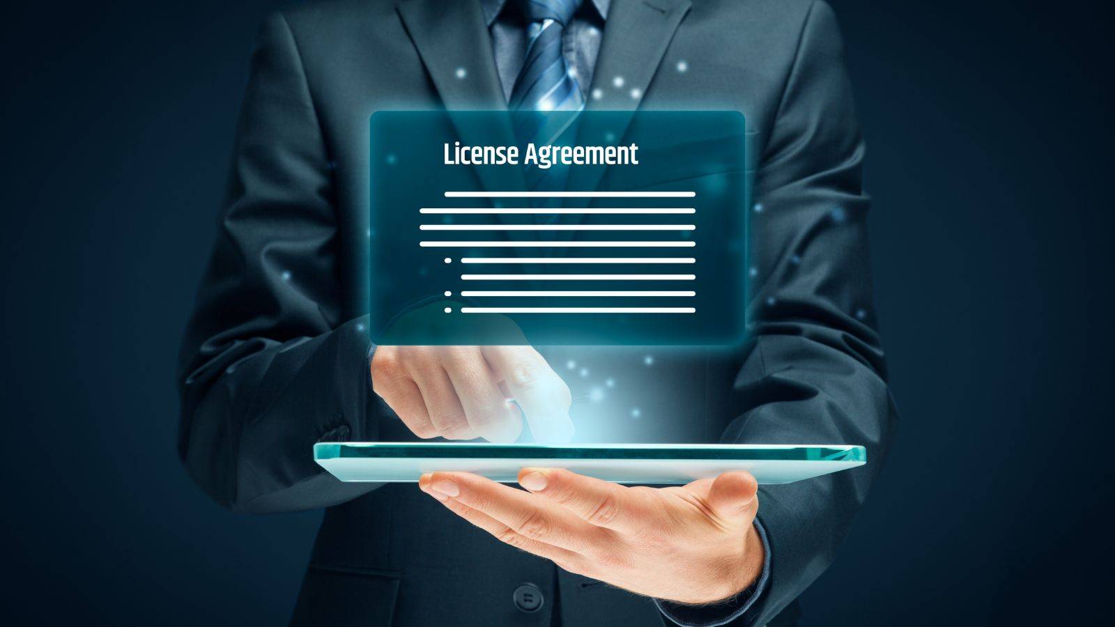 Professional hands holding tablet displaying License Agreement interface representing sponsor licence refusal revocation legal processes and digital documentation