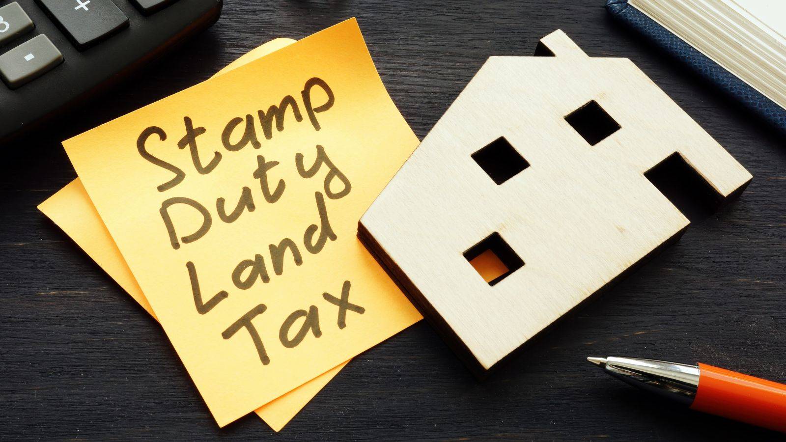 Stamp Duty Calculator sticky note with house cutout and pen