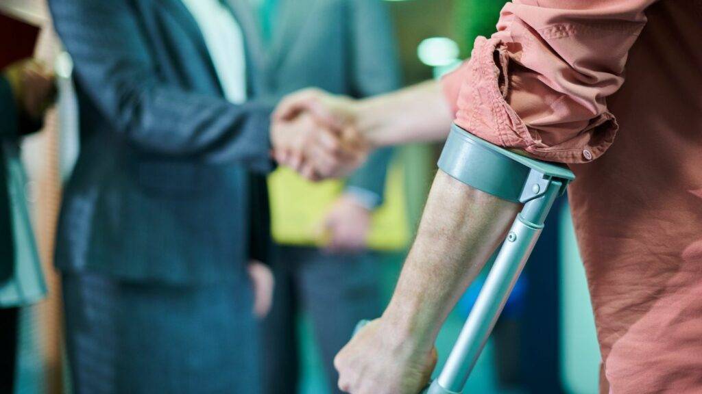 Injured person shaking hands with solicitor – Personal Injury Legal Help UK