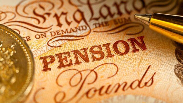 UK pension sharing concept with pound coin and note under pen