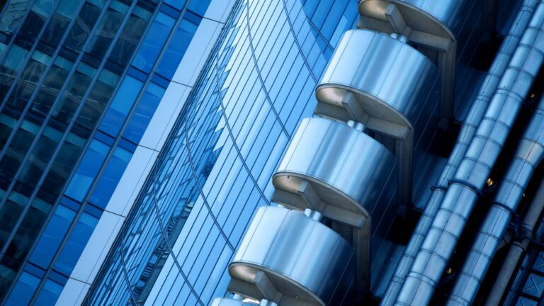 Lloyd's of London building with legal gavel overlay representing UK property law changes 2025