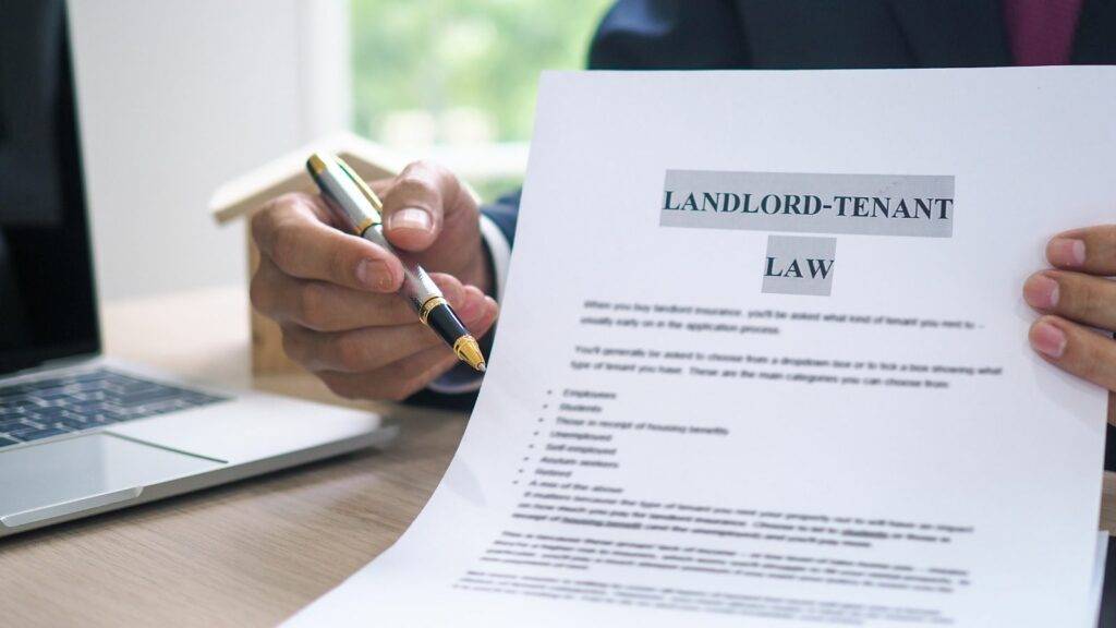 Renters Rights Bill 2025 - landlord reviewing legal tenant law document with pen