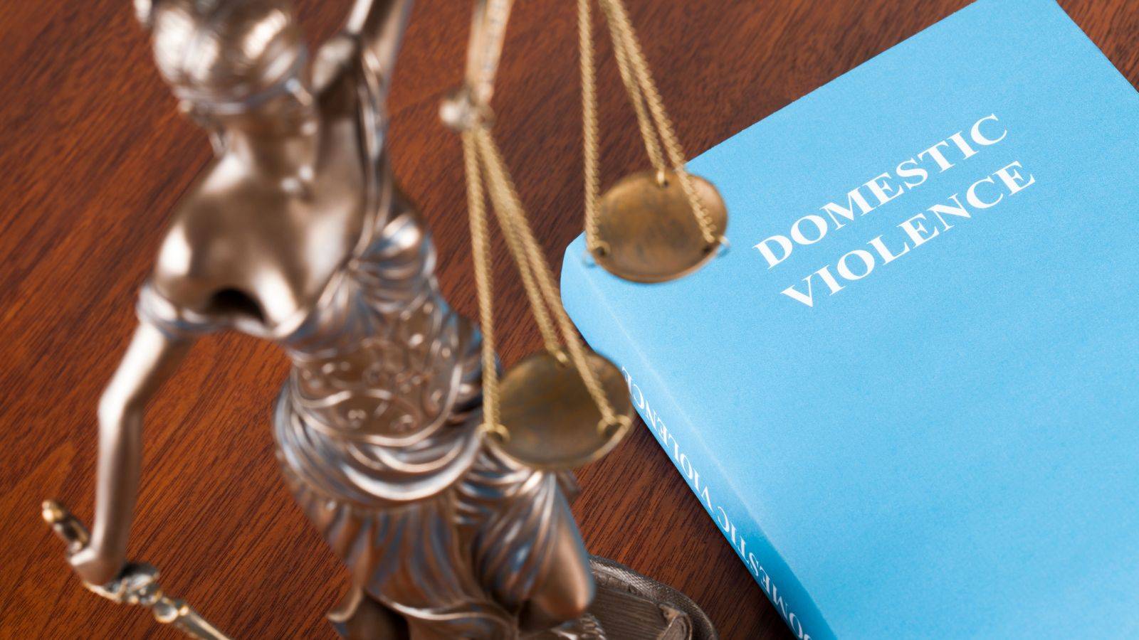 Legal gavel and domestic violence law book representing expert domestic violence solicitors UK 2025 legal protection services