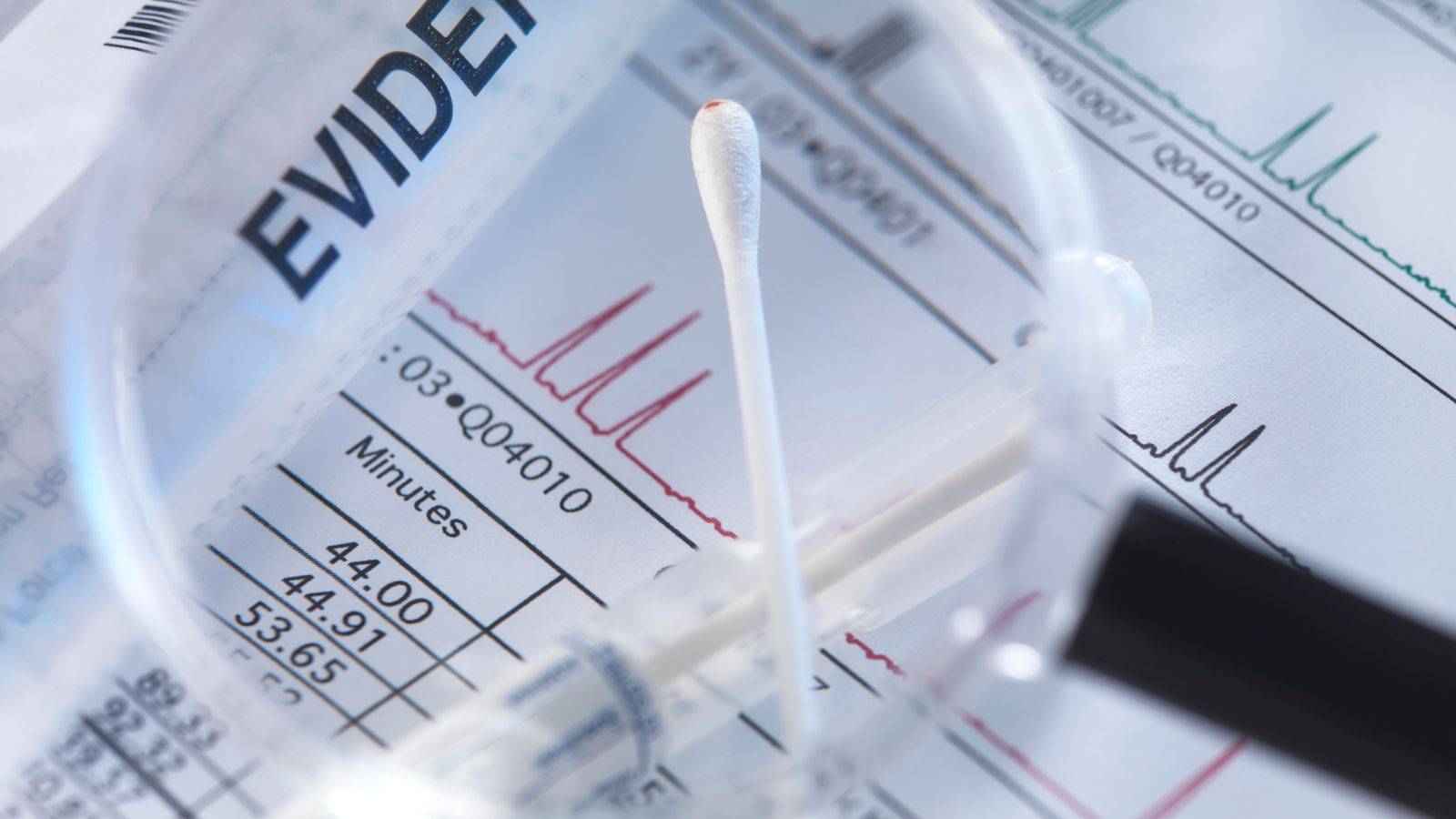 Financial evidence analysis with documents and magnifying glass representing asset tracing solicitors London 2025 investigation expertise for POCA defence