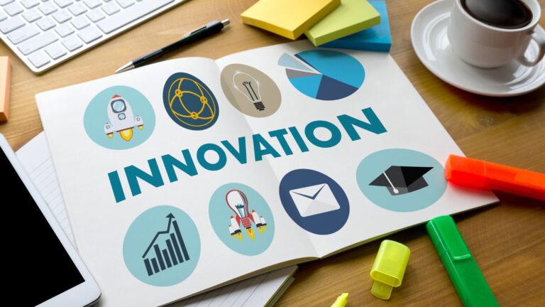 Business workspace with innovation planning documents and charts representing Innovator visa closed Innovator Founder transition guide for UK entrepreneurs and immigration law guidance
