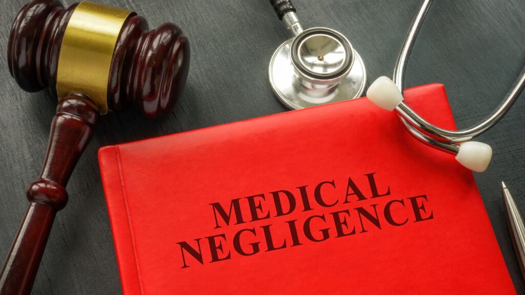 Medical negligence legal concept showing gavel and stethoscope representing medical negligence claim calculator UK 2025