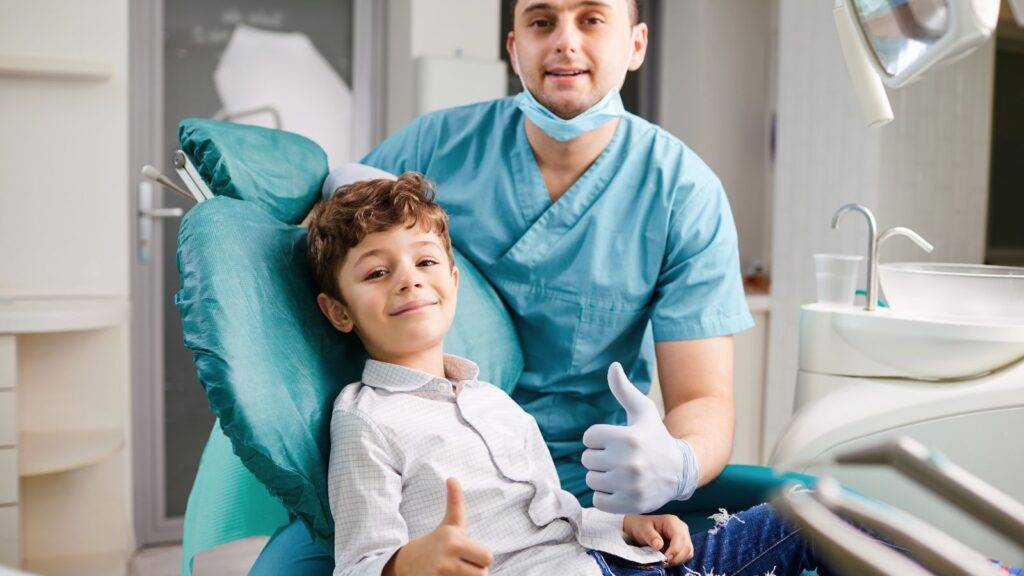 Happy child receiving professional medical care representing child injury compensation calculator UK 2025 healthcare assessment