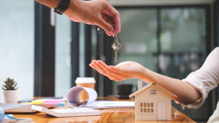 Hands exchanging house keys representing Standish v Standish matrimonial property 2025 asset transfer ruling
