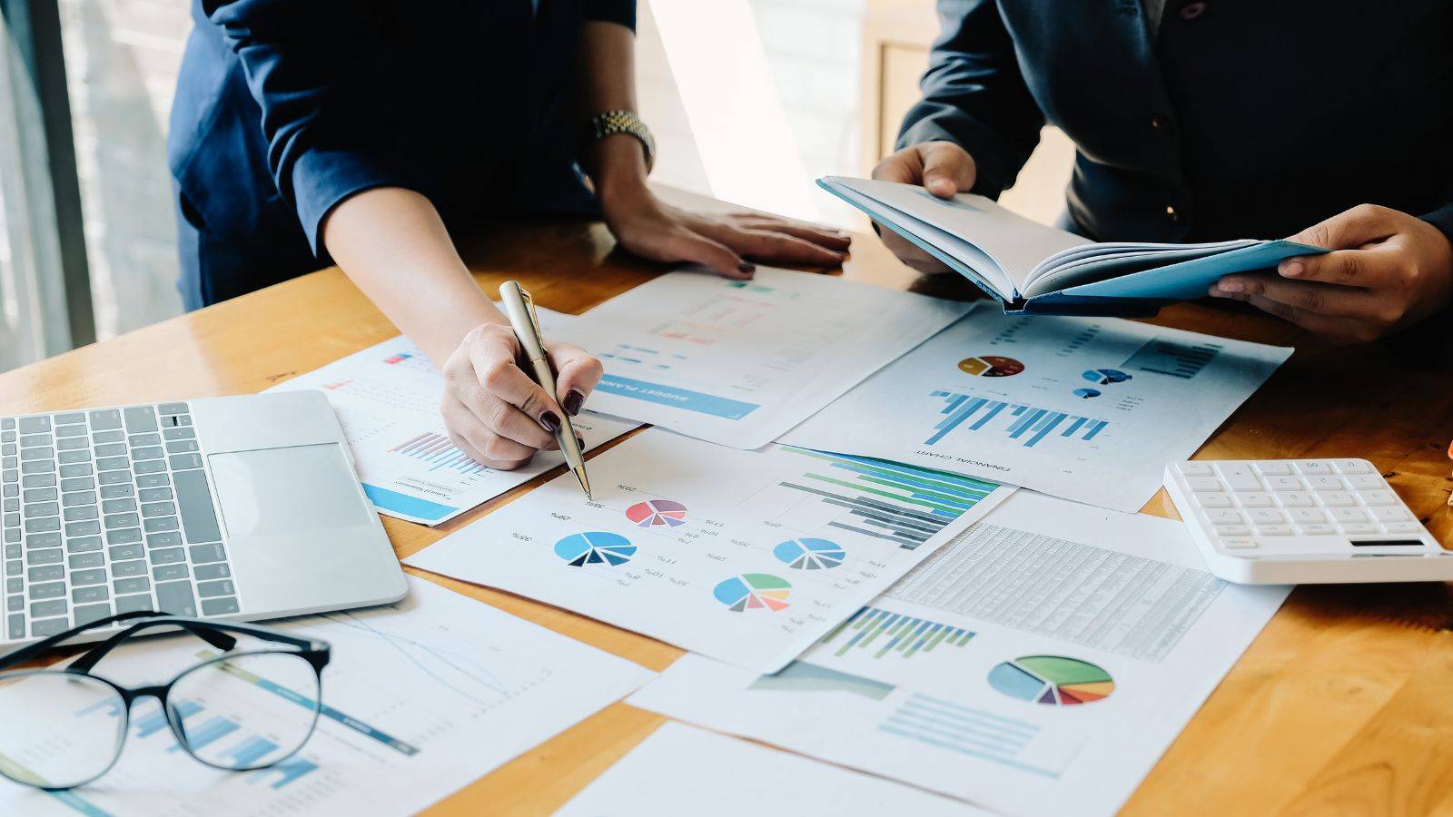 Tax advisory London consultation with financial charts and calculator